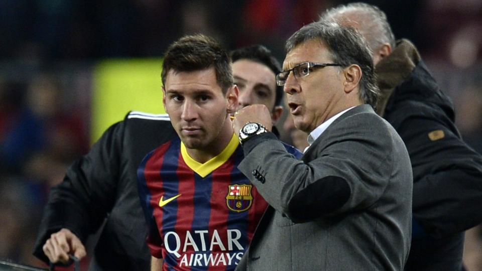 Lionel Messi and Gerardo Martino of Barcelona